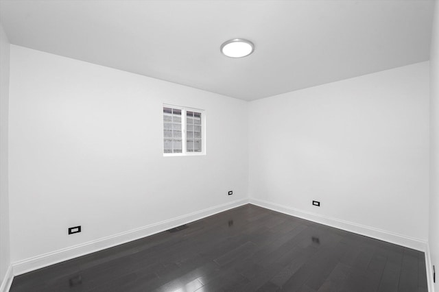 6903 S Ada St, Chicago, IL 60636 - unfurnished room featuring baseboards and dark wood-style floors
