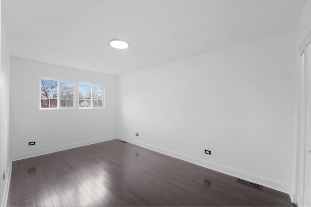 6903 S Ada St, Chicago, IL 60636 - unfurnished bedroom with baseboards and dark wood finished floors