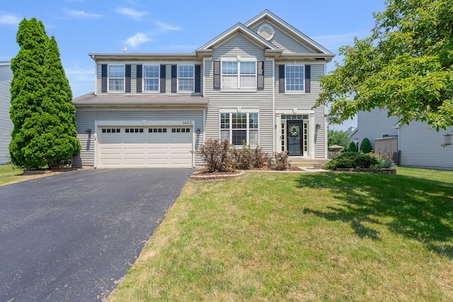 1453 Waterside Dr, Bolingbrook, IL 60490 - view of front of house with driveway, an attached garage, and a front yard