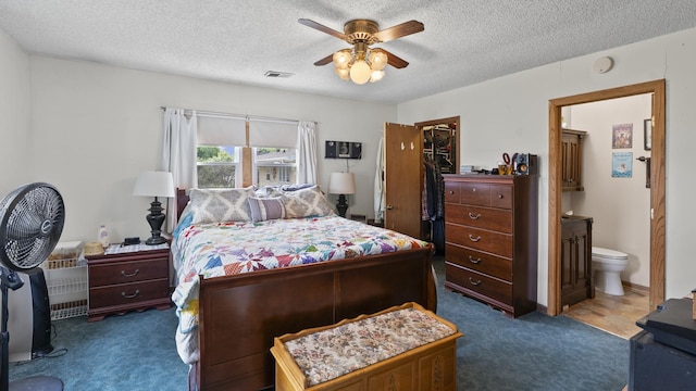 714 Cedardale Pl, Aurora, IL 60506 - bedroom with carpet, a textured ceiling, ensuite bathroom, a spacious closet, and ceiling fan
