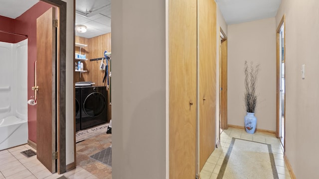 714 Cedardale Pl, Aurora, IL 60506 - corridor featuring separate washer and dryer and light tile patterned floors