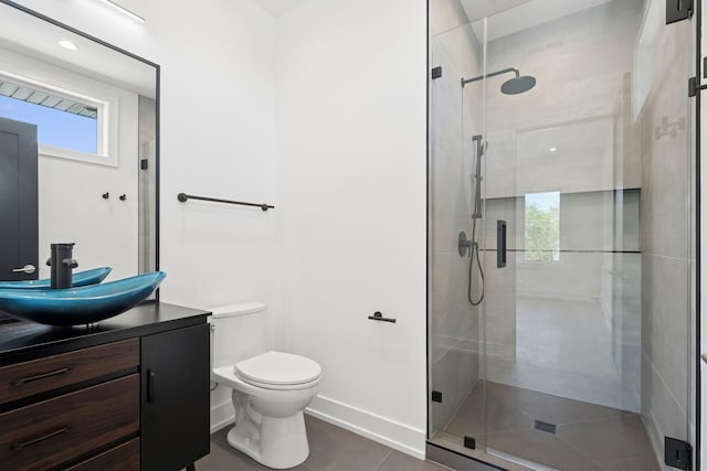 9214 N Washington St, Niles, IL 60714 - bathroom with vanity, toilet, a shower stall, and plenty of natural light