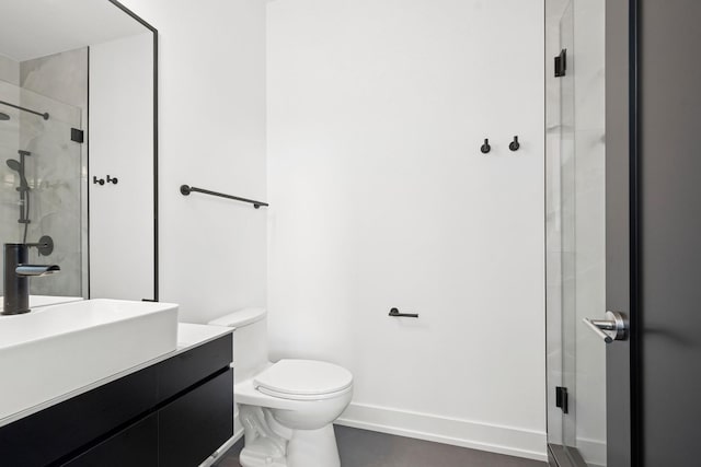 9214 N Washington St, Niles, IL 60714 - bathroom featuring vanity, a stall shower, baseboards, and toilet