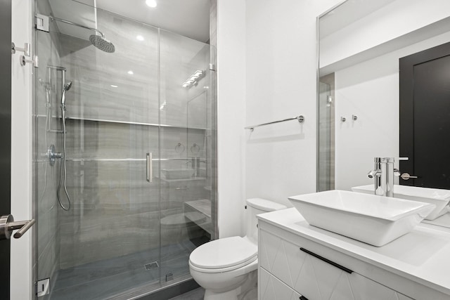 9214 N Washington St, Niles, IL 60714 - bathroom featuring toilet, vanity, a shower stall, and recessed lighting