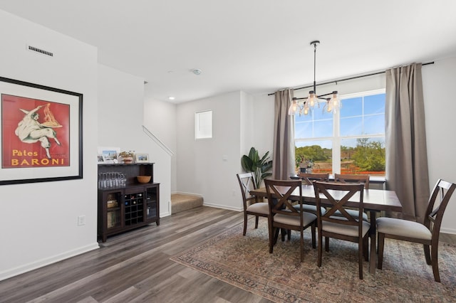 2011 Sequoia Ave, Mundelein, IL 60060 - dining area featuring wood finished floors, a chandelier, and baseboards