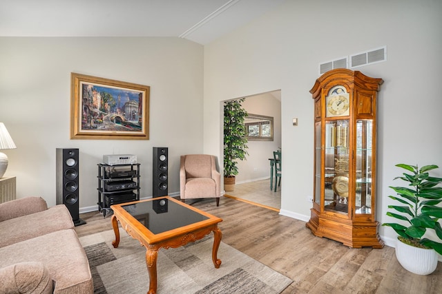 291 Georgetown Ave, Romeoville, IL 60446 - living room featuring lofted ceiling, light wood finished floors, and baseboards