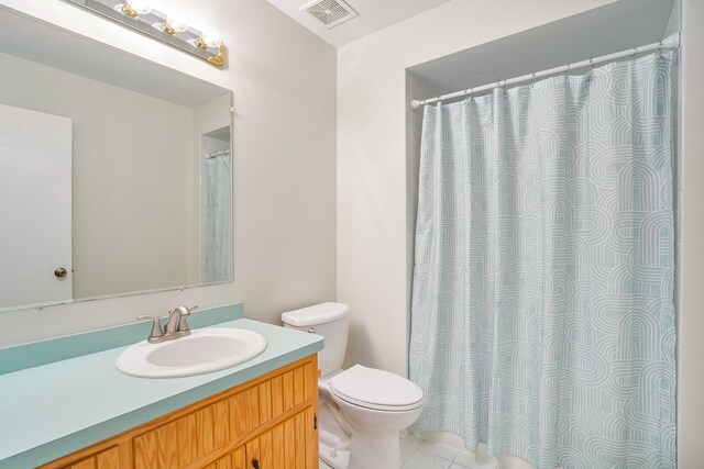291 Georgetown Ave, Romeoville, IL 60446 - bathroom featuring toilet, vanity, tile patterned flooring, and a shower with curtain