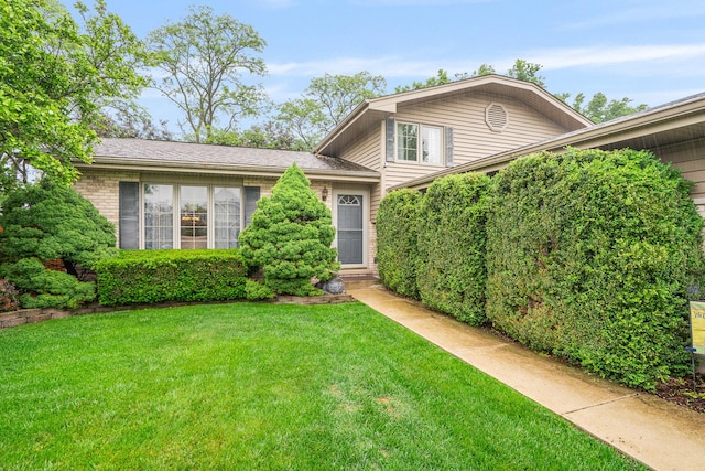 291 Georgetown Ave, Romeoville, IL 60446 - split level home with a front yard and brick siding