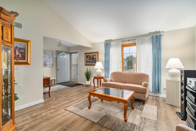 291 Georgetown Ave, Romeoville, IL 60446 - living area with baseboards, light wood-type flooring, and high vaulted ceiling