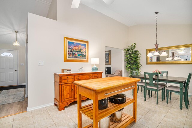 291 Georgetown Ave, Romeoville, IL 60446 - dining room with high vaulted ceiling, baseboards, and light tile patterned floors