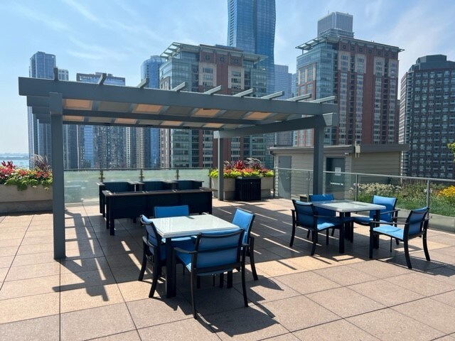 474 N Lake Shore Dr Unit 2101, Chicago, IL 60611 - view of patio with outdoor dining area and a city view