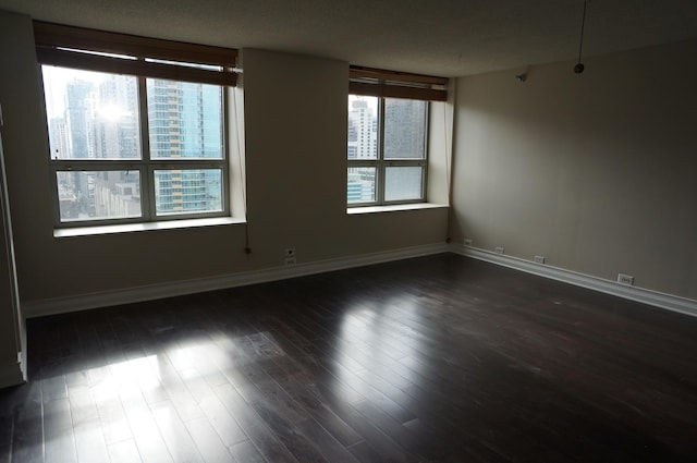 474 N Lake Shore Dr Unit 2101, Chicago, IL 60611 - empty room featuring baseboards and dark wood-type flooring