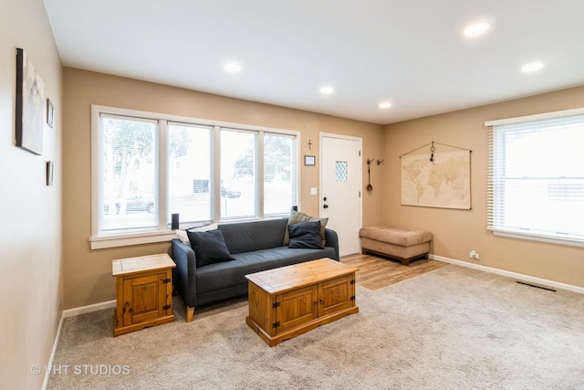 106 N Berteau Ave, Bartlett, IL 60103 - living area with light carpet, baseboards, and recessed lighting