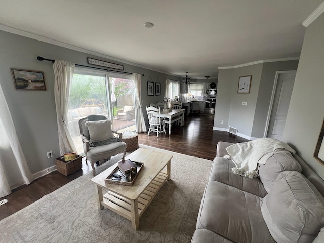 7003 94th Ave, Kenosha, WI 53142 - living area with dark wood-style flooring, ornamental molding, and baseboards