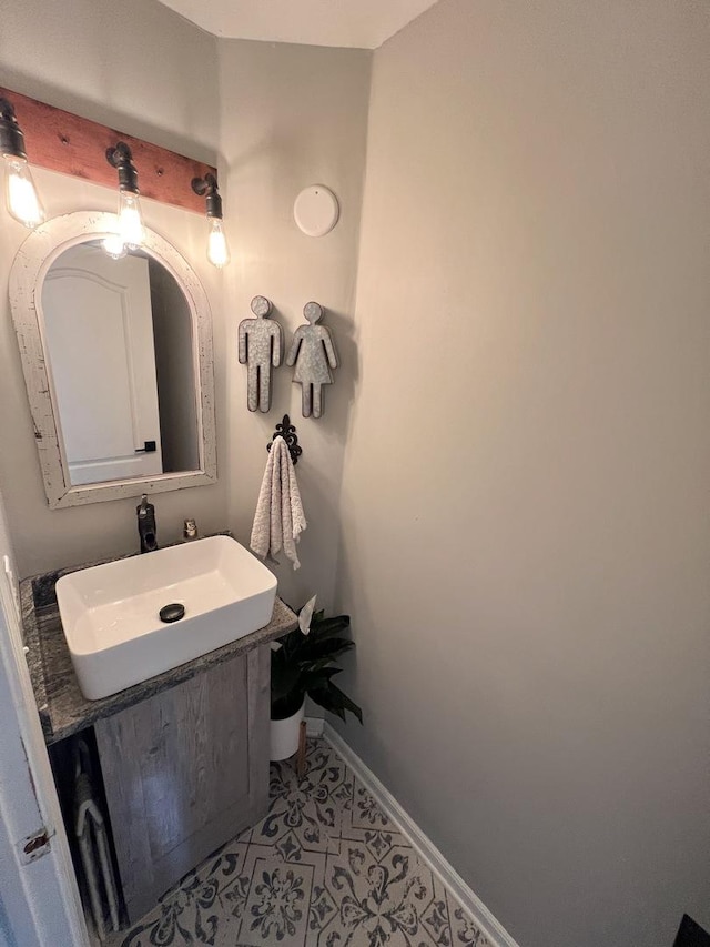 7003 94th Ave, Kenosha, WI 53142 - bathroom with vanity, baseboards, and tile patterned floors