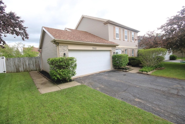 7003 94th Ave, Kenosha, WI 53142 - view of home's exterior with asphalt driveway, a garage, and roof with shingles