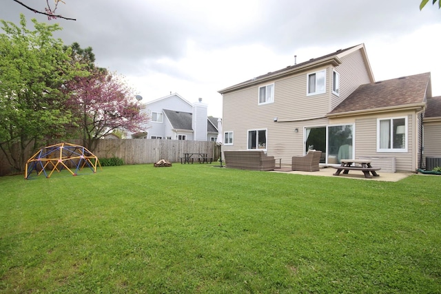 7003 94th Ave, Kenosha, WI 53142 - rear view of house with an outdoor living space, a patio area, and a shingled roof