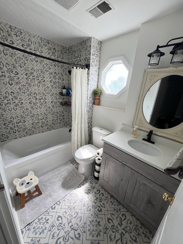 7003 94th Ave, Kenosha, WI 53142 - full bath featuring shower / bath combo with shower curtain, toilet, vanity, and tile patterned floors