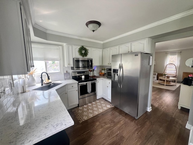 7003 94th Ave, Kenosha, WI 53142 - kitchen with stainless steel appliances, a sink, dark wood-style floors, light stone countertops, and backsplash