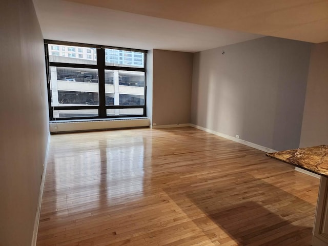 680 N Lake Shore Dr Unit 716, Chicago, IL 60611 - unfurnished room with light wood-type flooring, baseboards, and a baseboard radiator