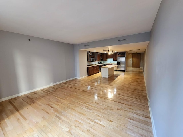 680 N Lake Shore Dr Unit 716, Chicago, IL 60611 - unfurnished living room featuring light wood finished floors and baseboards