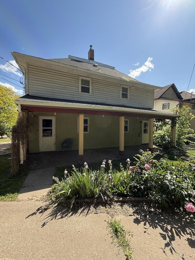 428 Chicago Ave, Savanna, IL 61074 - rear view of house with a chimney