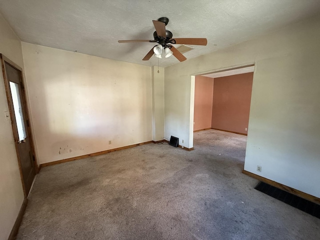 428 Chicago Ave, Savanna, IL 61074 - carpeted spare room with ceiling fan and baseboards