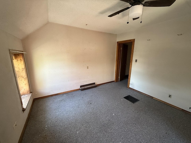 428 Chicago Ave, Savanna, IL 61074 - carpeted spare room with a ceiling fan, lofted ceiling, and baseboards