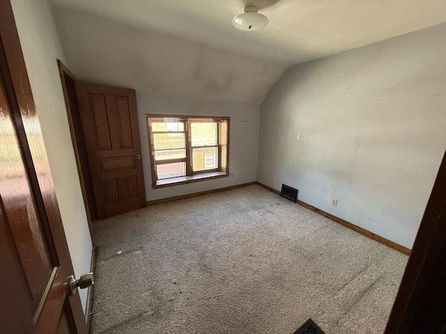 428 Chicago Ave, Savanna, IL 61074 - empty room featuring light colored carpet, lofted ceiling, and baseboards