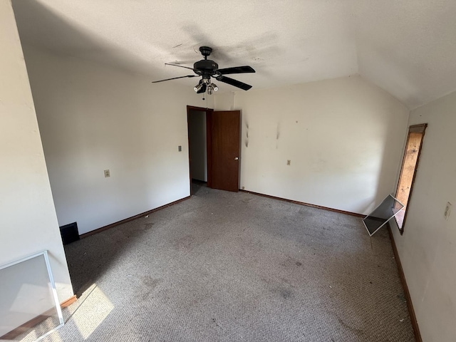 428 Chicago Ave, Savanna, IL 61074 - carpeted spare room featuring ceiling fan, lofted ceiling, and baseboards