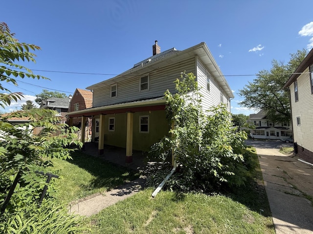 428 Chicago Ave, Savanna, IL 61074 - back of property with a chimney and a yard