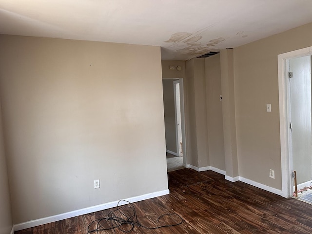 241 156th St, Calumet City, IL 60409 - empty room featuring dark wood-style floors and baseboards