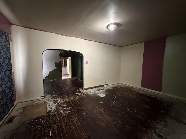 241 156th St, Calumet City, IL 60409 - empty room with arched walkways, baseboards, and wood finished floors