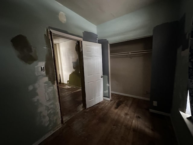 241 156th St, Calumet City, IL 60409 - unfurnished bedroom with hardwood / wood-style floors, a closet, lofted ceiling, and baseboards