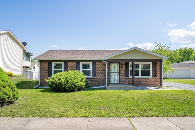 5831 Allemong Dr, Matteson, IL 60443 - view of front of house featuring brick siding, a front yard, and covered porch