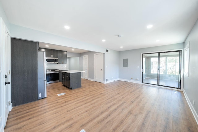 5831 Allemong Dr, Matteson, IL 60443 - unfurnished living room featuring baseboards, light wood-type flooring, recessed lighting, and electric panel