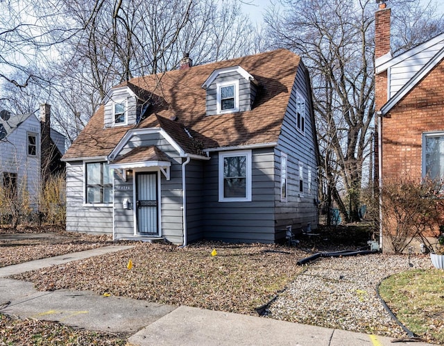 14746 Princeton Ave, Dolton, IL 60419 - view of front facade with a chimney and roof with shingles
