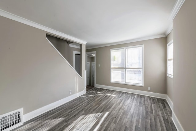 14746 Princeton Ave, Dolton, IL 60419 - empty room featuring dark wood-type flooring, ornamental molding, healthy amount of natural light, and baseboards