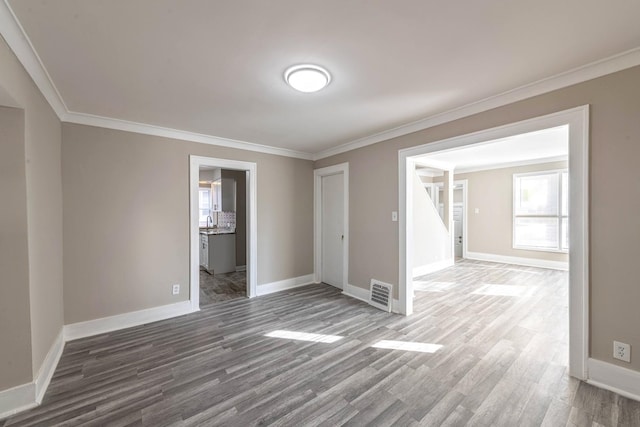 14746 Princeton Ave, Dolton, IL 60419 - spare room with wood finished floors, baseboards, and ornamental molding