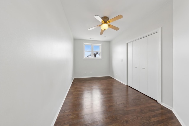 519 S Maplewood Ave Unit 4S, Chicago, IL 60612 - unfurnished bedroom with wood finished floors, baseboards, a closet, and a ceiling fan