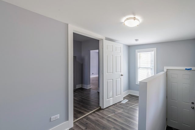 14446 Martin Luther King Jr Dr, Dolton, IL 60419 - corridor featuring baseboards, dark wood finished floors, and an upstairs landing