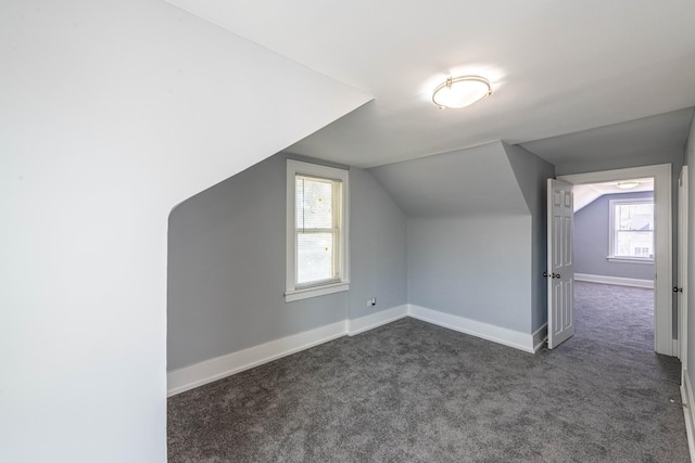 14446 Martin Luther King Jr Dr, Dolton, IL 60419 - additional living space with dark colored carpet, lofted ceiling, and baseboards