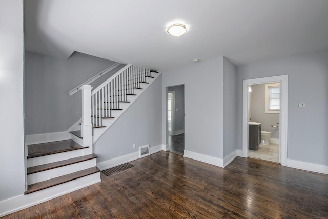 14446 Martin Luther King Jr Dr, Dolton, IL 60419 - stairs featuring wood finished floors and baseboards