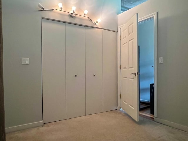 1001 W 15th St Unit 342, Chicago, IL 60608 - unfurnished bedroom with light colored carpet, a closet, and baseboards