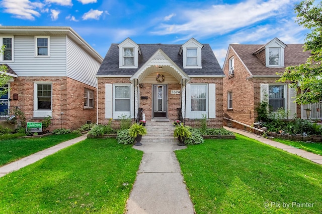 3324 N Ottawa Ave, Chicago, IL 60634 - view of front of property with brick siding, a front yard, and roof with shingles