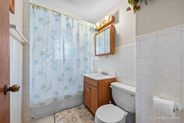 3324 N Ottawa Ave, Chicago, IL 60634 - full bathroom featuring vanity, tile walls, shower / bath combination with curtain, a wainscoted wall, and tile patterned flooring