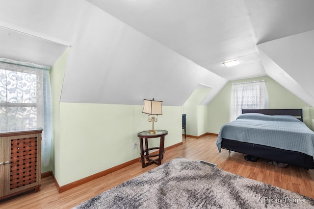 3324 N Ottawa Ave, Chicago, IL 60634 - bedroom featuring wood finished floors and vaulted ceiling