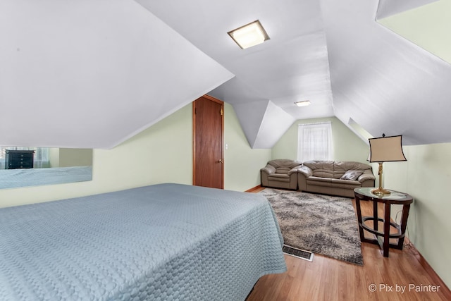 3324 N Ottawa Ave, Chicago, IL 60634 - bedroom featuring light wood-style flooring and vaulted ceiling
