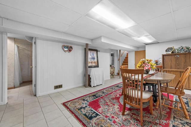 3324 N Ottawa Ave, Chicago, IL 60634 - dining space with stairs, light tile patterned flooring, and a paneled ceiling