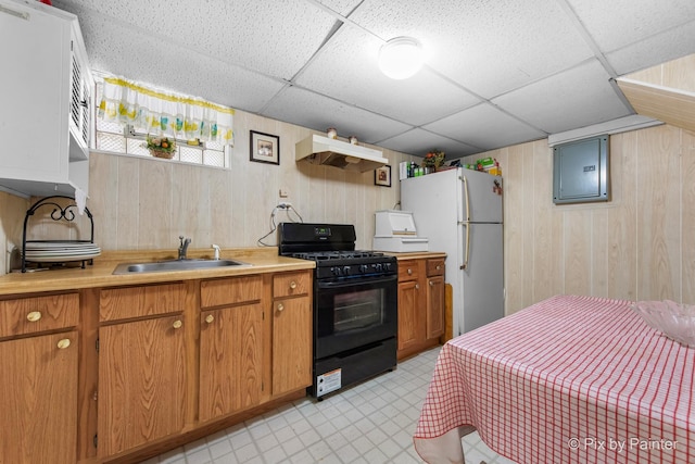3324 N Ottawa Ave, Chicago, IL 60634 - kitchen featuring black gas stove, custom exhaust hood, wooden walls, light countertops, and a paneled ceiling